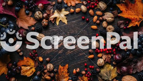 Autumn Harvest With Nuts, Berries, Fruits, And Leaves On Wooden Table